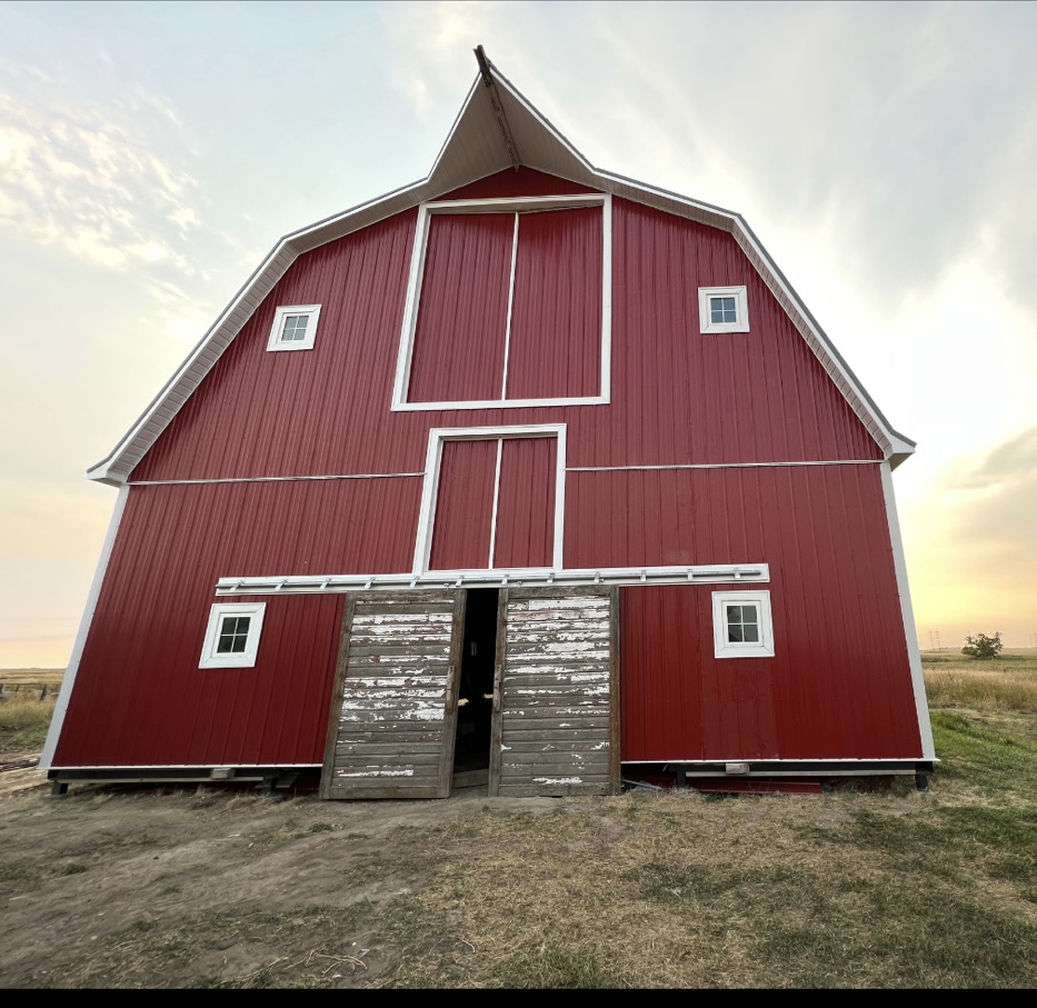 Barn exterior after Red Diamond exterior renovation with red metal siding